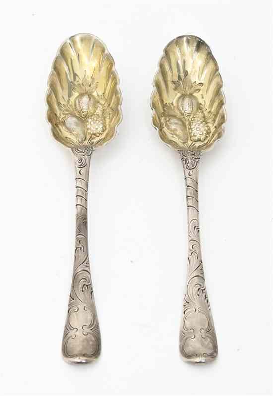 Appraisal: A Pair of Continental Silver Berry Spoons each having gilt