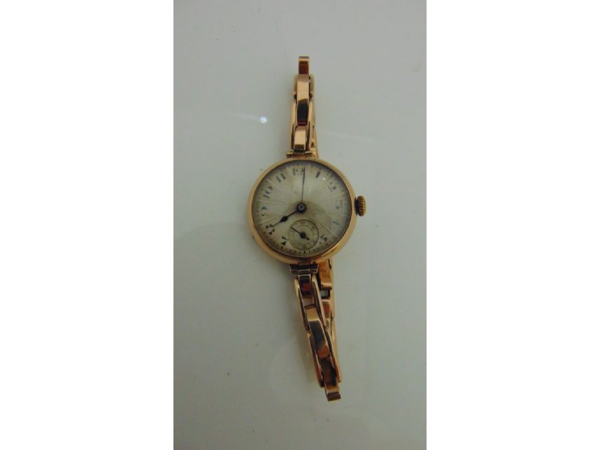 Appraisal: A lady's ct rose gold wristwatch the textured silvered dial