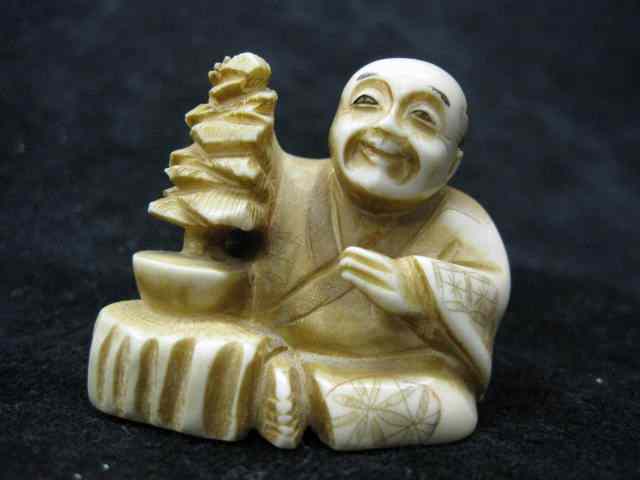 Appraisal: Carved Ivory Netsuke of Seated Manwith bonsai tree '' signed