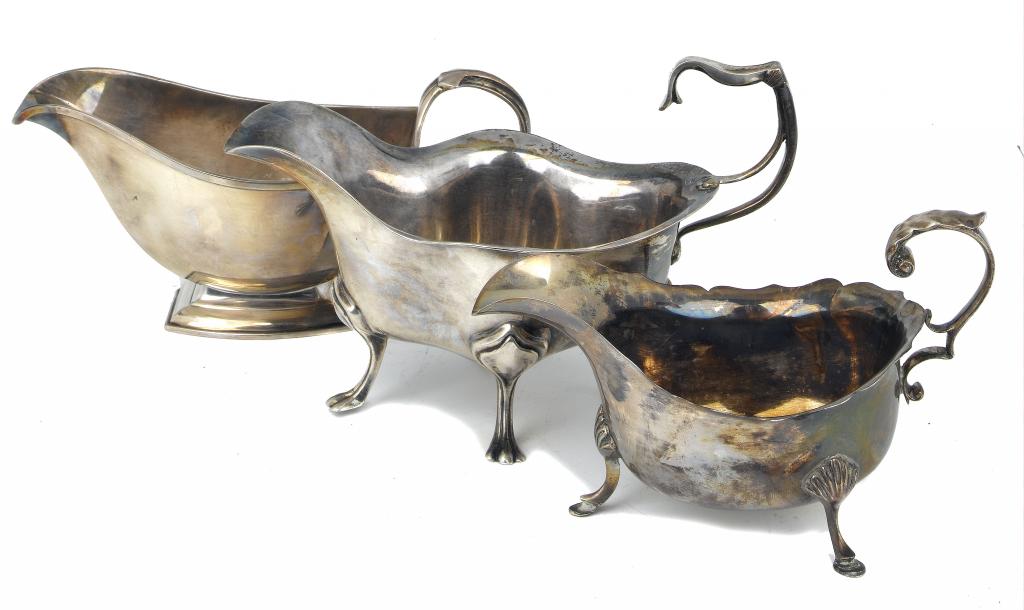 Appraisal: A GEORGE V SAUCE BOAT OF HEAVY GAUGE AND TWO