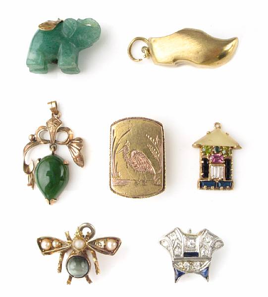 Appraisal: A collection of fourteen gem and gold charms pendants and