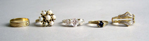 Appraisal: Nine K gold rings to include diamond chips pearls cubic