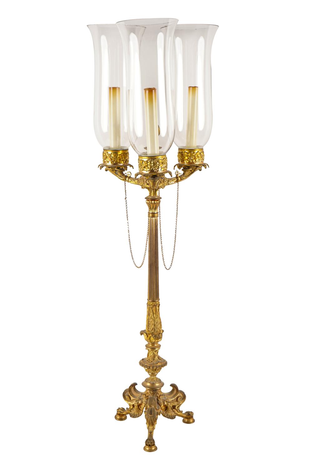 Appraisal: EMPIRE STYLE GILT BRONZE TABLE LAMPhaving three candles arms each