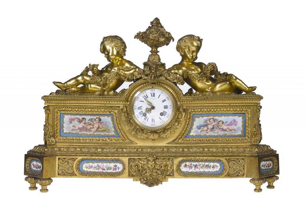 Appraisal: A FRENCH GILT BRONZE MANTEL CLOCK the Louis XVI style