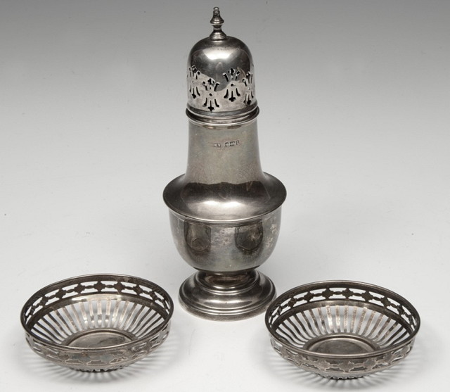 Appraisal: A SILVER BALUSTER CASTOR with pierced cover Sheffield cm and