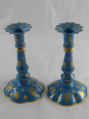 Appraisal: A pair of Halcyon Days blue enamel toleware candlesticks in