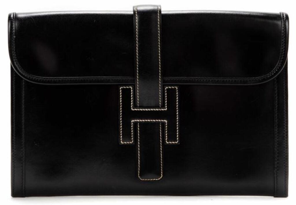 Appraisal: Hermes Jige pouch in black smooth leather with front pull