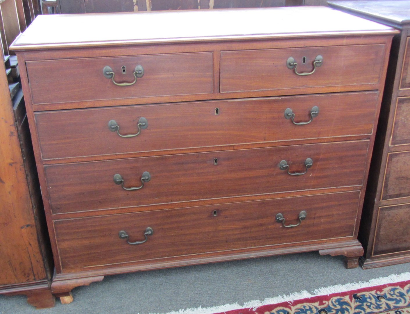 Appraisal: A George III mahogany chest of two short and three