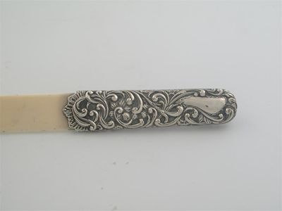 Appraisal: A late Victorian mounted ivory page turner with embossed hilt