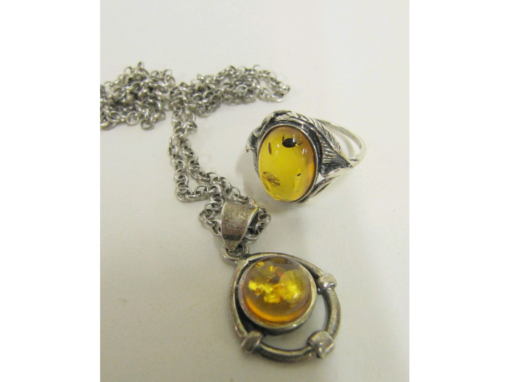 Appraisal: Lot comprising a silver amber set ring with similar pendant