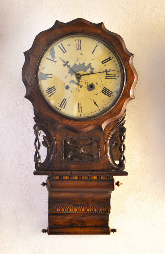 Appraisal: E N WELCH CARVED INLAID WALL CLOCK Shaped wood bezel