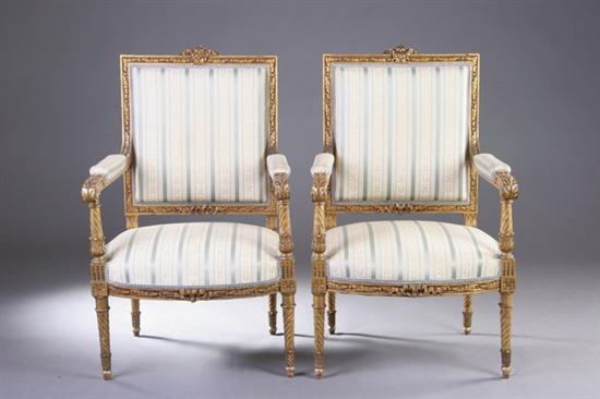 Appraisal: PAIR LOUIS XVI STYLE GILTWOOD FAUTEUILS th century with stripe