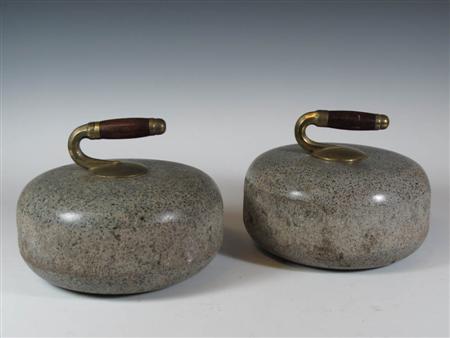 Appraisal: A pair of grey granite curling stones each with rosewood