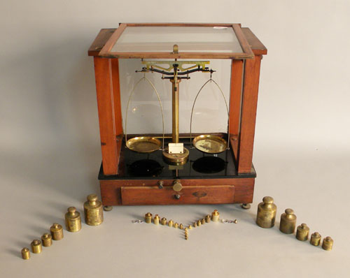 Appraisal: A mahogany cased balance scale with assorted brass weights ca