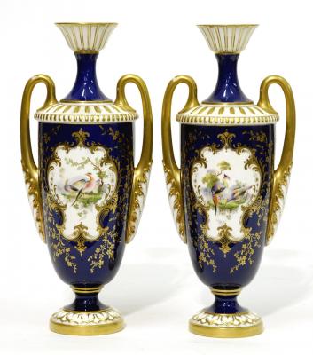 Appraisal: A PAIR OF ROYAL WORCESTER PORCELAIN VASES of ovoid form