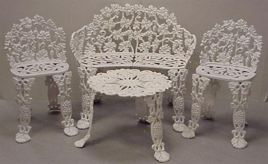 Appraisal: Cast iron garden furniture with elaborate pierced grapevine motif includes