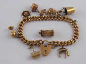 Appraisal: A carat gold charm bracelet with eight charms gross weight