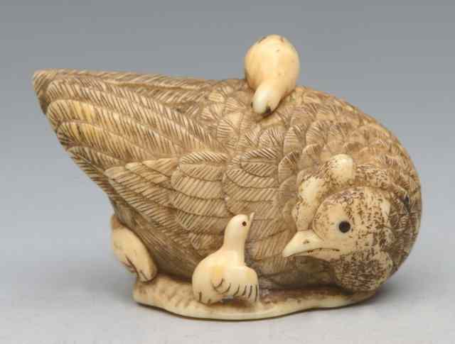 Appraisal: A JAPANESE IVORY NETSUKE in the form of a hen