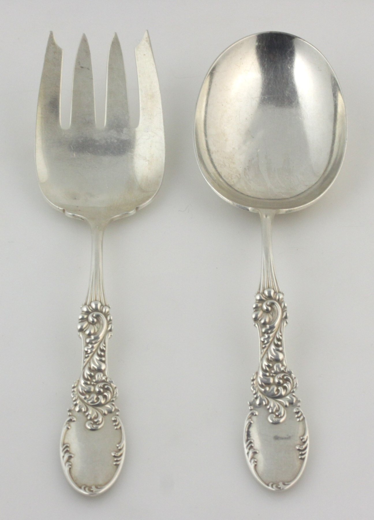 Appraisal: A pair of American silver servers marked sterling with floral