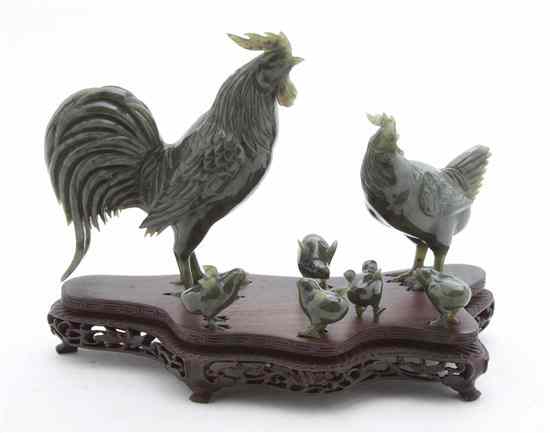 Appraisal: Seven Chinese Hardstone Chickens of spinach colored stone comprising a