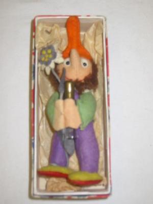 Appraisal: An unusual Schuco felt Gnome modelled standing holding a glass