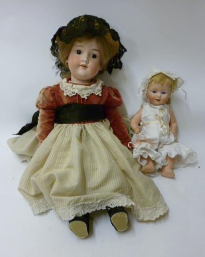 Appraisal: An Armand Marseille bisque head girl doll with fixed brown