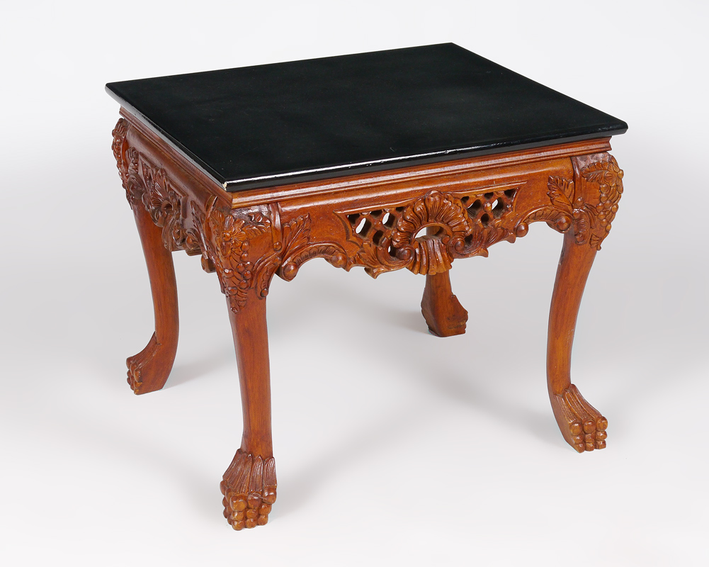 Appraisal: CARVED MAHOGANY SIDE TABLE Laminate top over carved and pierced