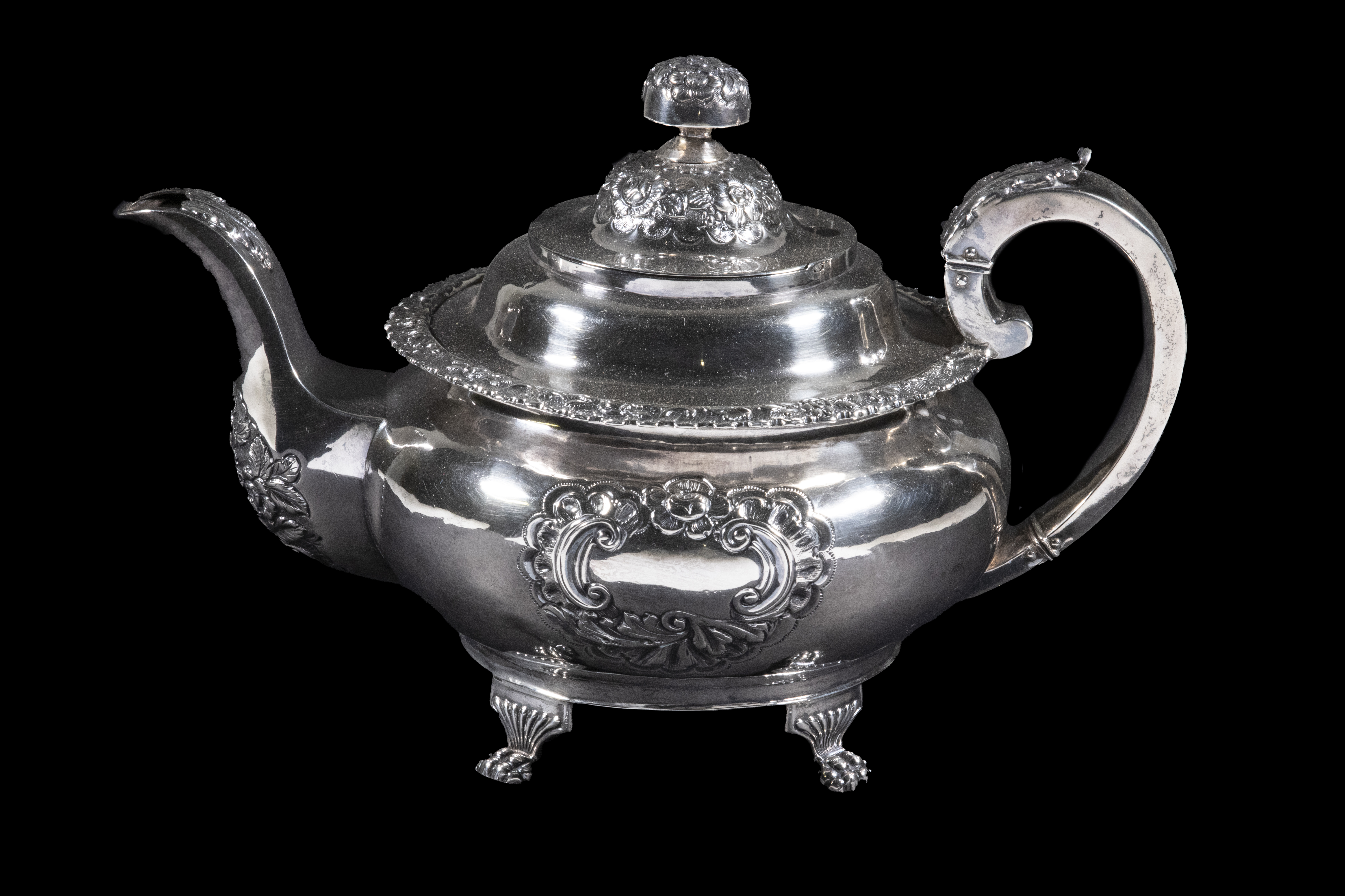 Appraisal: GEORGE IV IRISH SILVER TEAPOT Repousse Decorated Sterling Silver Teapot