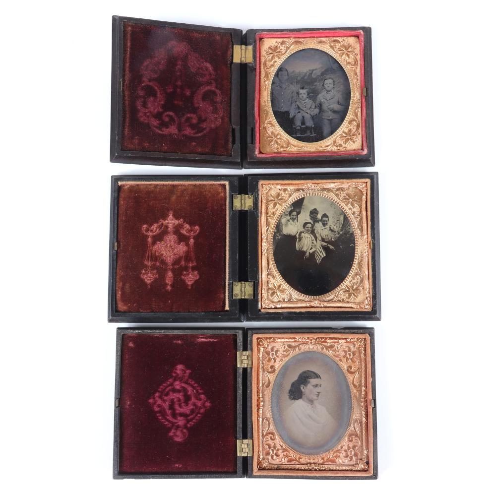 Appraisal: THREE ANTIQUE PLATE PHOTOGRAPHS IN GUTTA PERCHA BOX FRAMES WITH