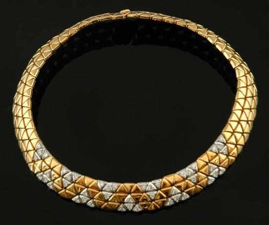 Appraisal: A gold and diamond collar The wide collar of articulated