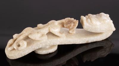 Appraisal: A Chinese grey jade belt hook th Century carved as