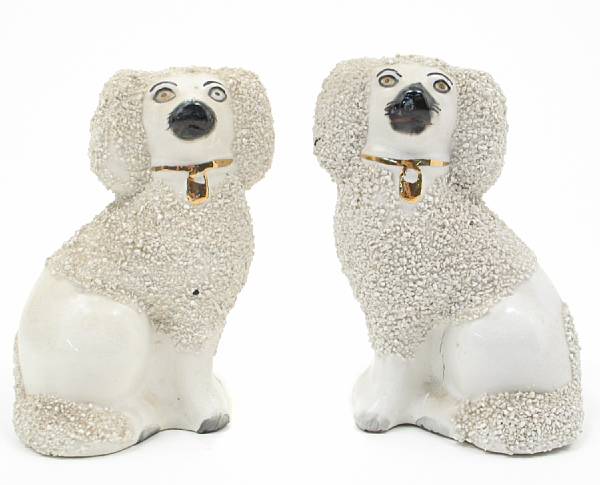 Appraisal: A pair of small porcelain Staffordshire dogs height in