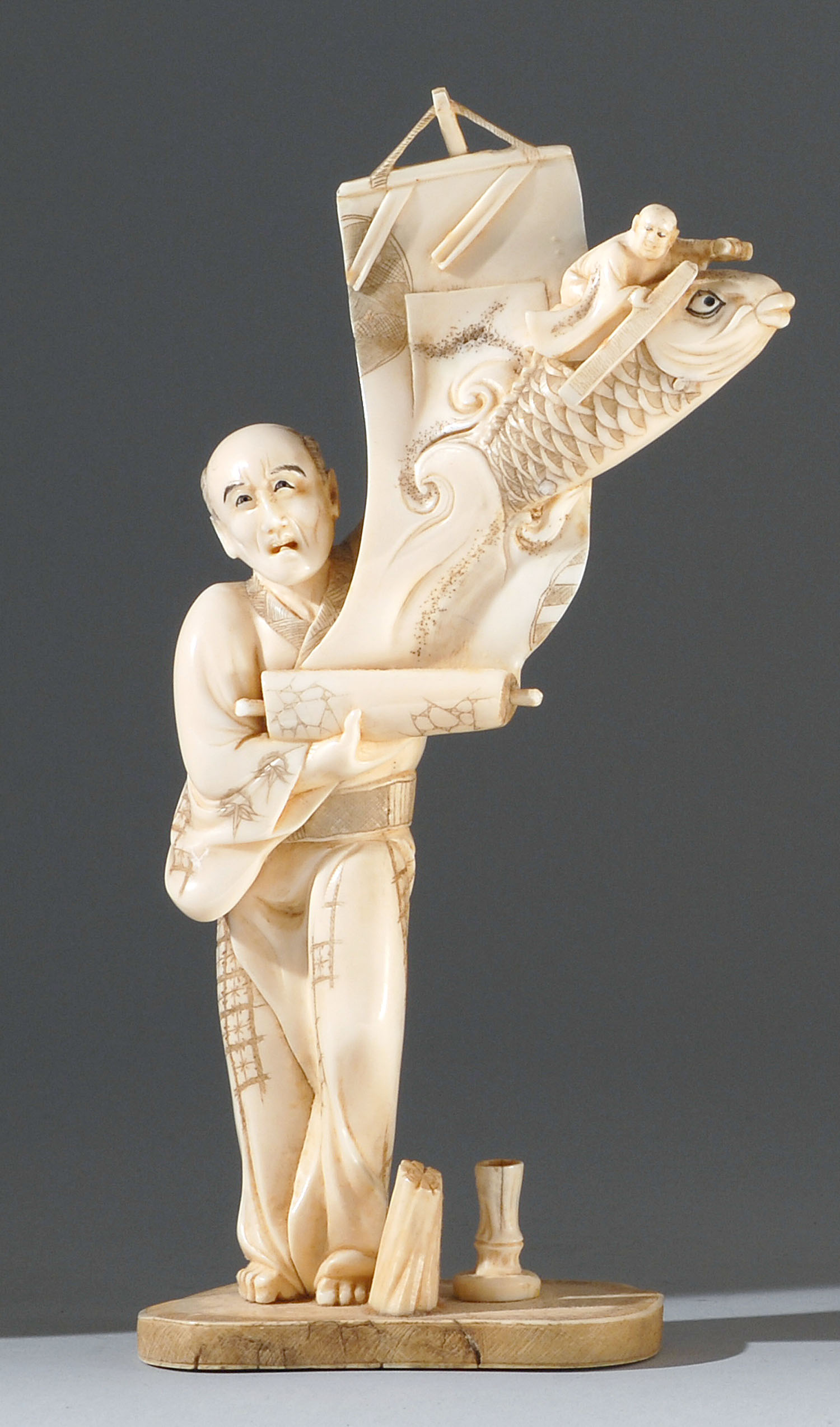 Appraisal: IVORY CARVING Meiji PeriodIn the form of a man unrolling