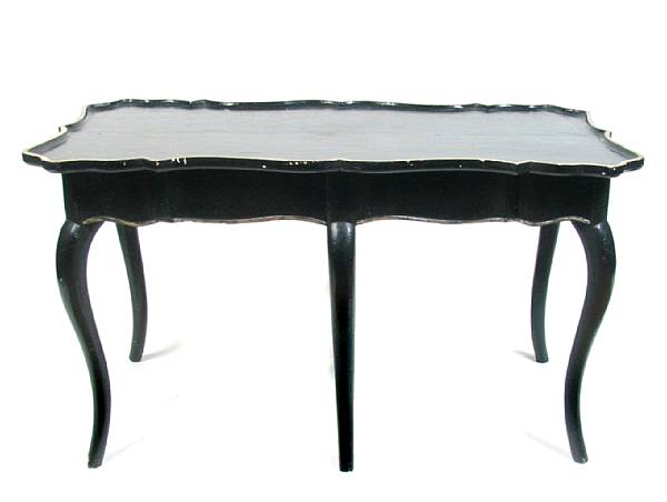 Appraisal: An ebonized low occasional table with silver leaf detail height