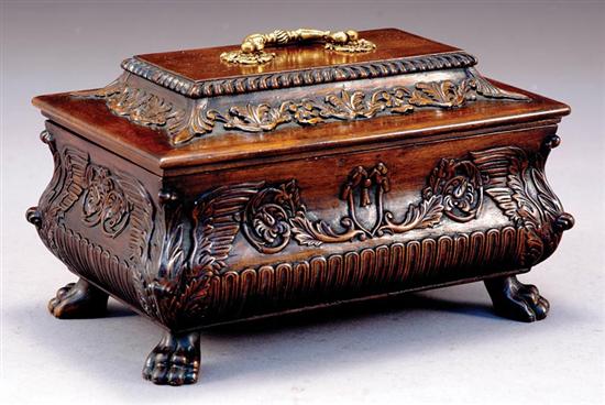 Appraisal: English carved mahogany tea caddy coffin-form lid with handle hinged