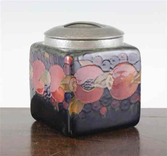 Appraisal: A Moorcroft Pomegranate design square biscuit barrel made for Liberty