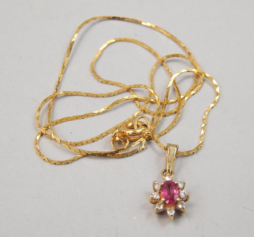 Appraisal: An ct gold necklace the pendant with a pink central