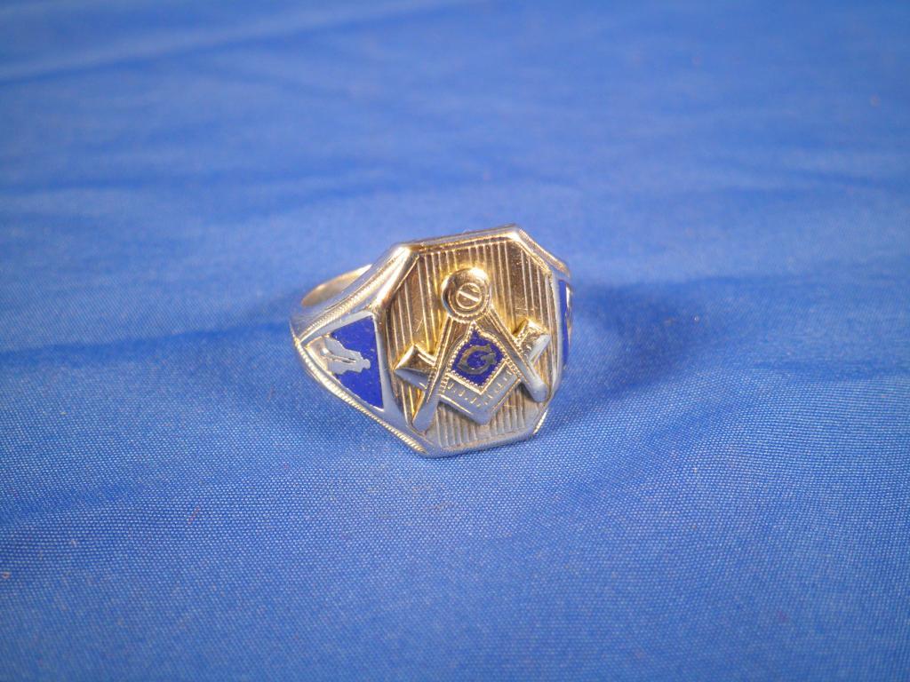 Appraisal: A white metal and enamelled masonic ring bearing initial to