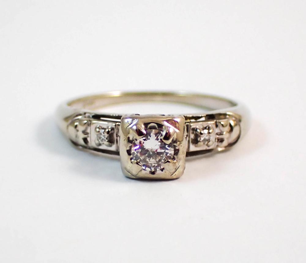 Appraisal: DIAMOND AND FOURTEEN KARAT WHITE GOLD RING with one round