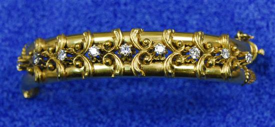 Appraisal: K YELLOW GOLD AND DIAMOND ANTIQUE BANGLE BRACELET with prong