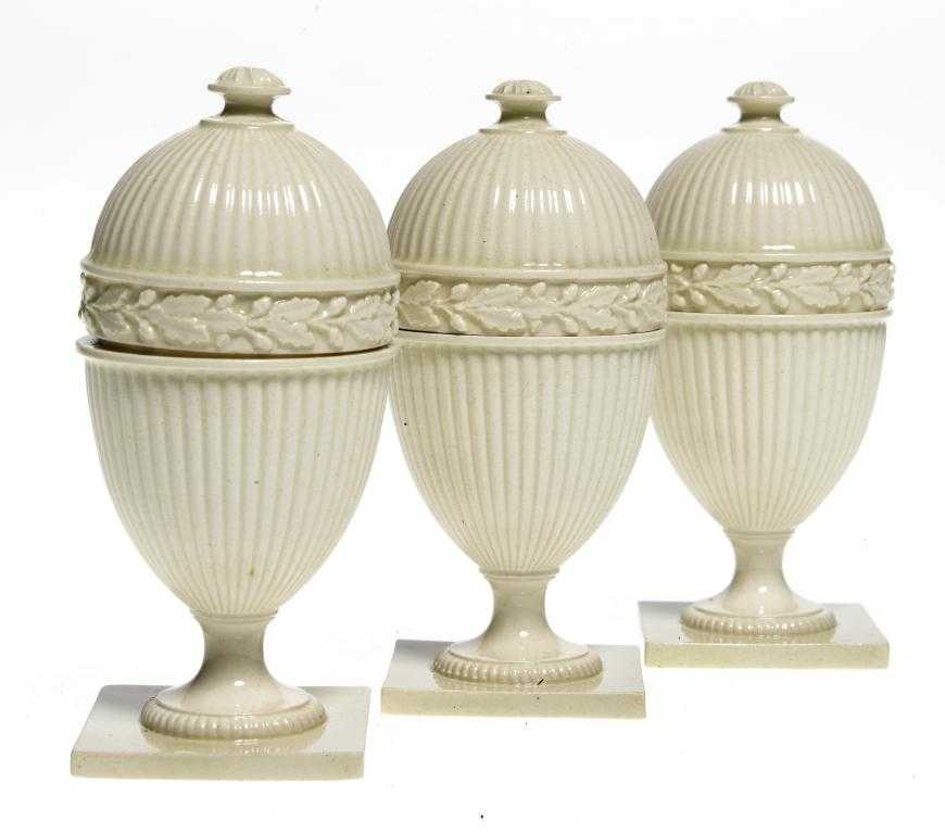 Appraisal: A SET OF THREE WEDGWOOD QUEEN'S WARE EGG CUPS AND