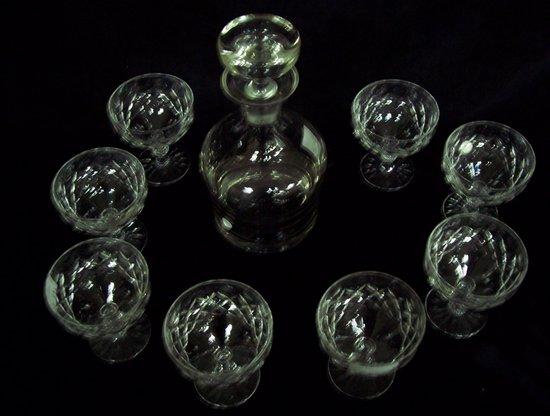 Appraisal: Eight cut champagne glasses and a plain glass decanter