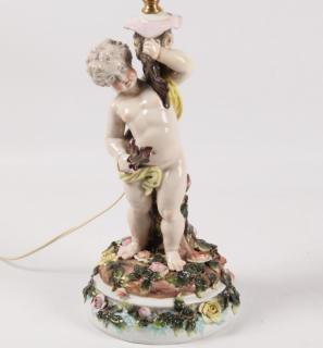 Appraisal: DRESDEN PORCELAIN FIGURE OF A CUPID HOLDING WHAT APPEARS TO