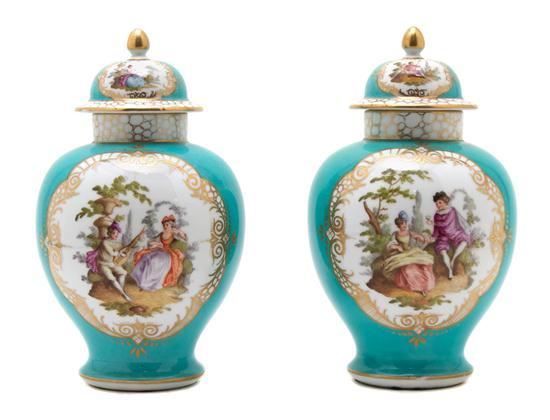 Appraisal: Pair of German Porcelain Urns and Covers decorated with courting