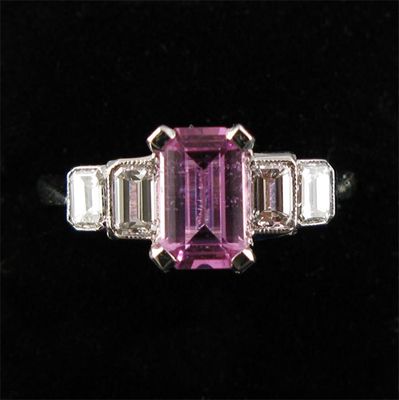 Appraisal: A pink sapphire and diamond ring the step cut sapphire