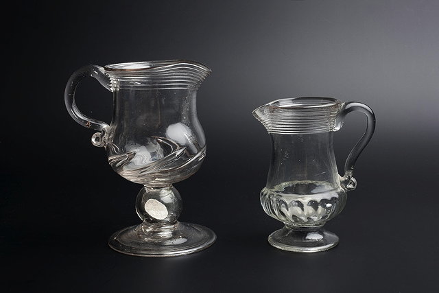 Appraisal: A GEORGE III GLASS CREAM JUG of baluster form having