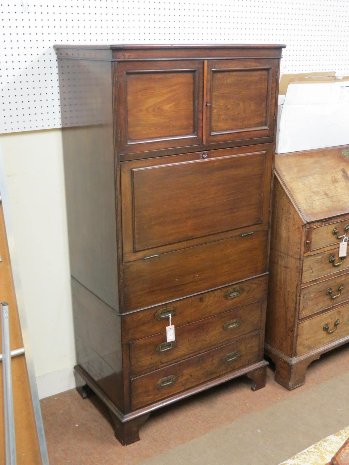 Appraisal: A Victorian cellarette cupboard pair of panelled cupboards above fall-front