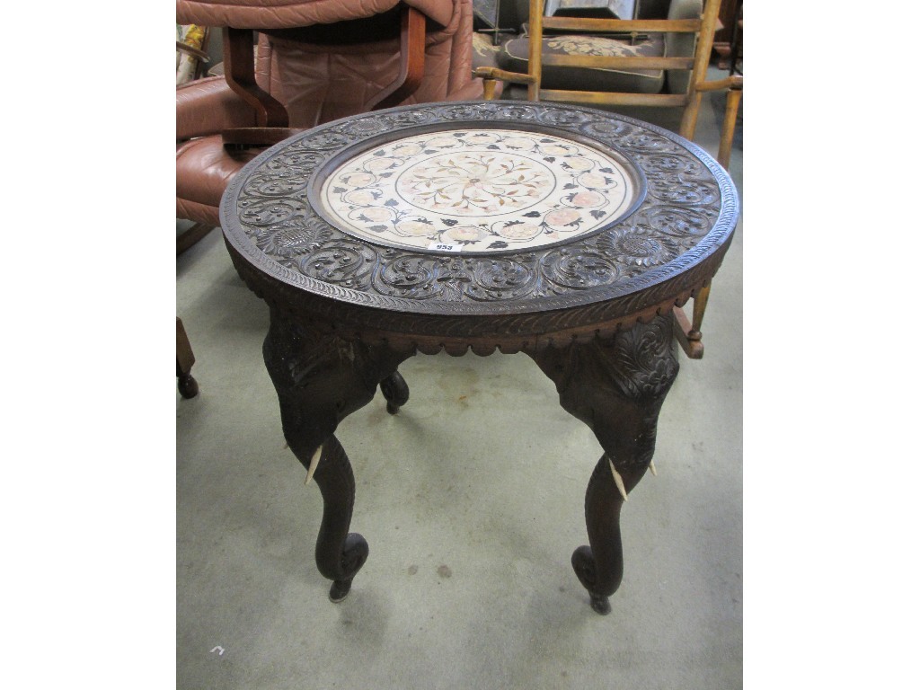 Appraisal: Burmese carved circular elephant table with an alabaster insert