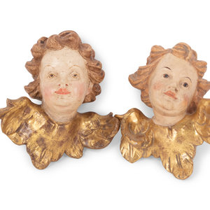 Appraisal: A Pair of Continental Painted and Parcel Gilt Putto Masks