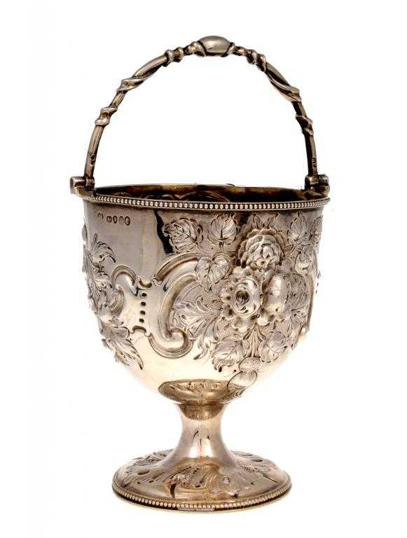 Appraisal: A VICTORIAN SUGAR BASKET with entwined swing handle the urnular